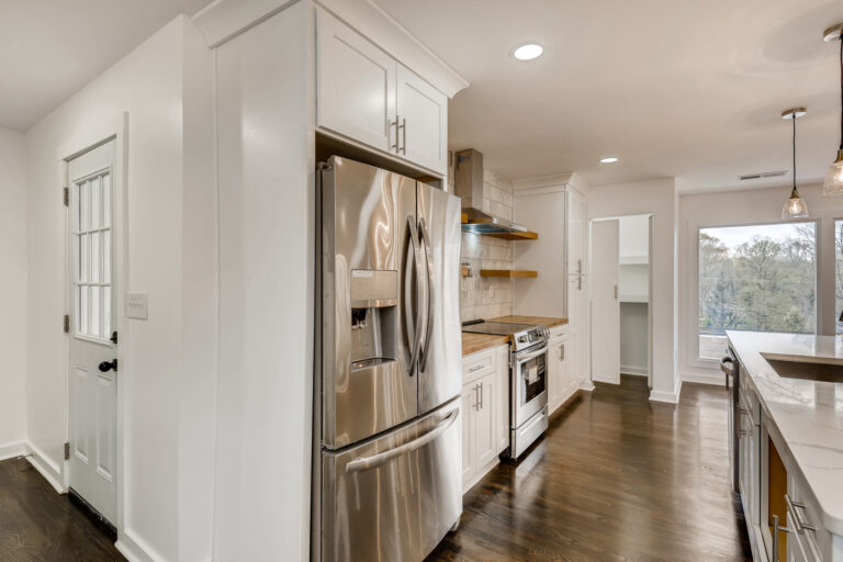 Kitchen renovation with white cabinetry and stainless steel appliances - Parsons Mission Construction Atlanta metro