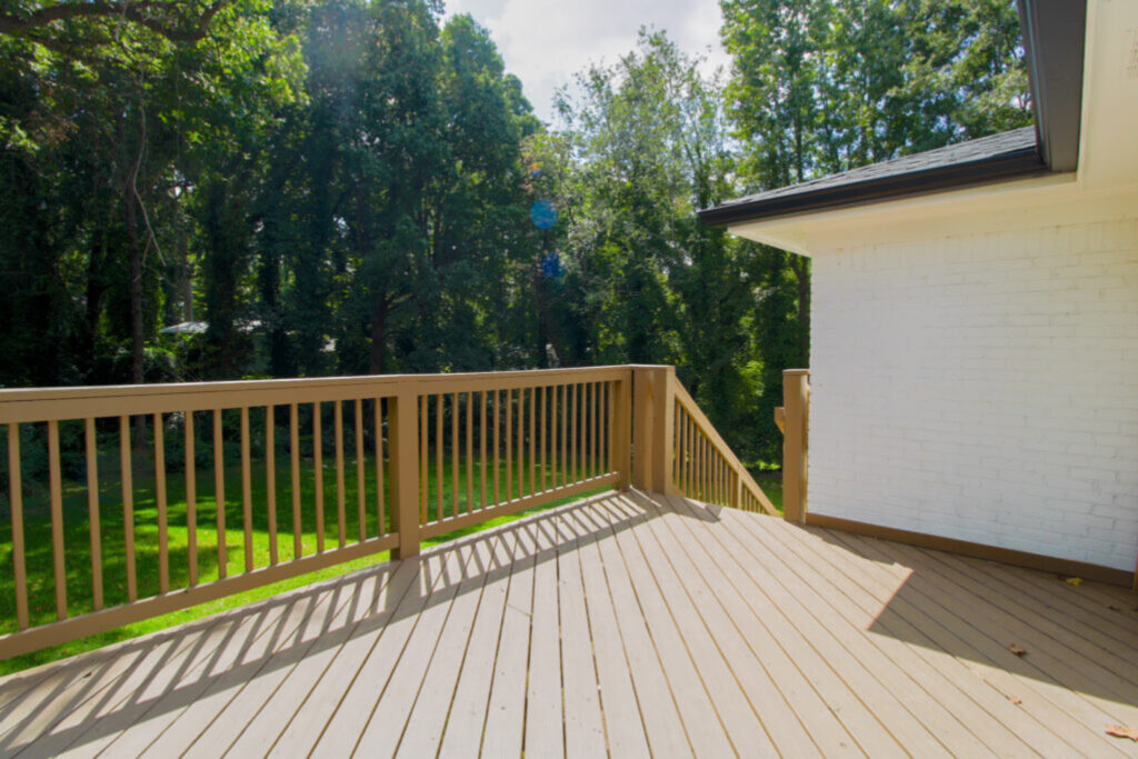 New wood deck construction with railing overlooking backyard in Atlanta metro | Parsons Mission Construction